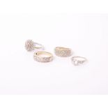 Three 9ct gold and diamond dress rings and a cubic zirconia ring, comprising; a small diamond