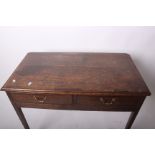 An early 19th century oak side table with crossbanded mahogany top and two drawers 93cm wide