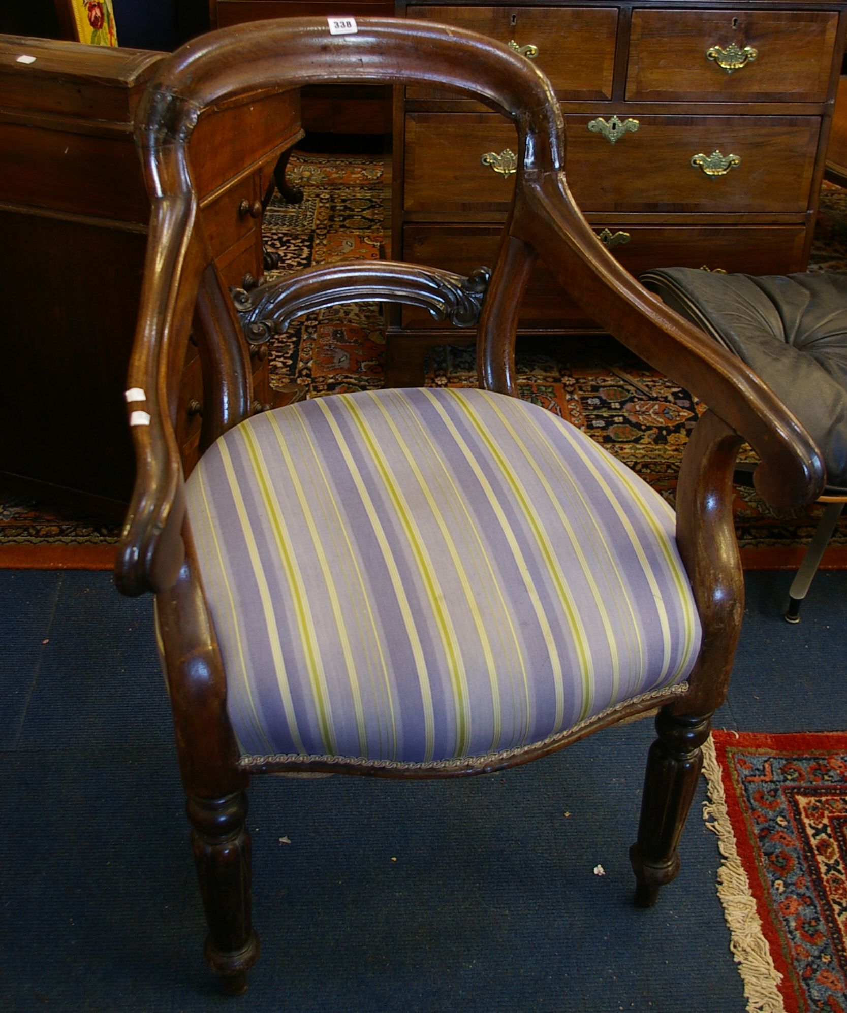 A 19th century mahogany yoke back library chair