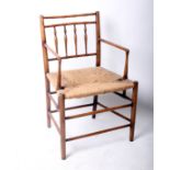 An Arts and Crafts beech delicate spindle back open arm chair with woven rush seat w.57cm