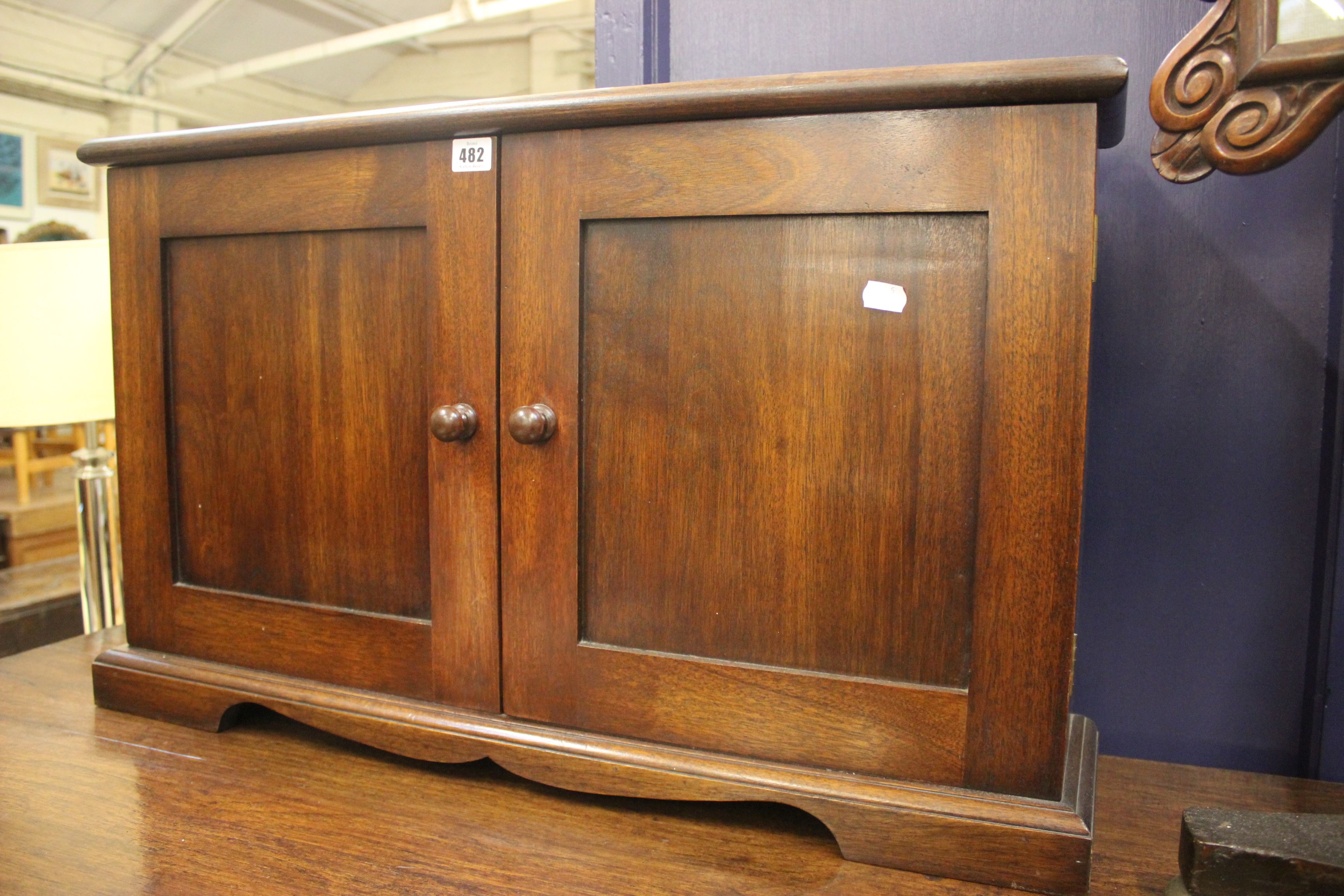 A mahogany table top shallow cabinet fitted adjustable shelves, on bracket feet, w: 80cm, h: 48cm,