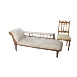 An Edwardian chaise longue with turned supports and a side chair (in need of restoration)