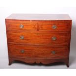 An early 19th century inlaid mahogany bowfront chest with two short and two long drawers, with a