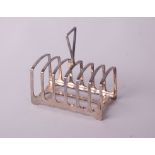 A silver six division toast rack with a central angular handle, Sheffield 1901 by James Dixon &