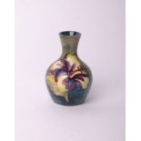 A small Moorcroft spill vase, paper label to base, height 10cm