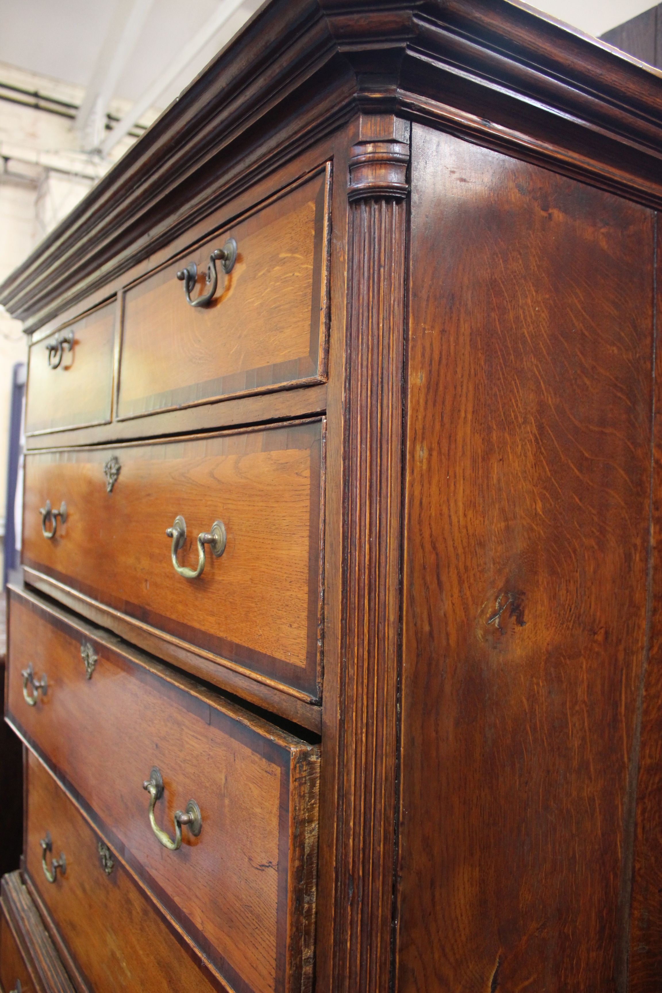 A George III stained oak chest on chest of two short and six long drawers with mahogany crossbanding - Image 3 of 3