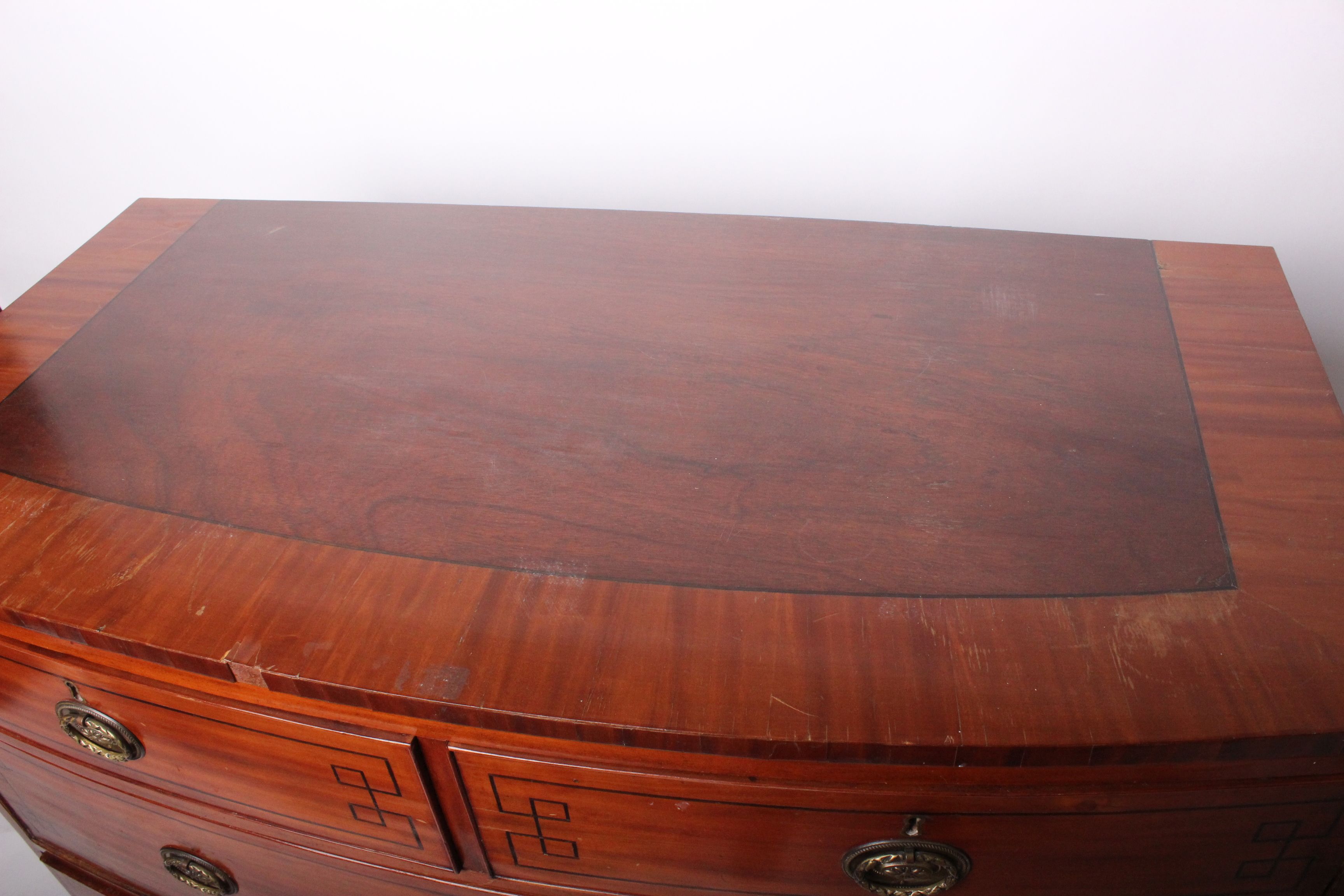 An early 19th century inlaid mahogany bowfront chest with two short and two long drawers, with a - Image 2 of 2