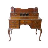 An 19th century unusual writing/dressing table, in well carved mahogany with a fitted stand