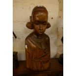 An African wooden carving, half torso of a young girl with babe in arms, 20th century