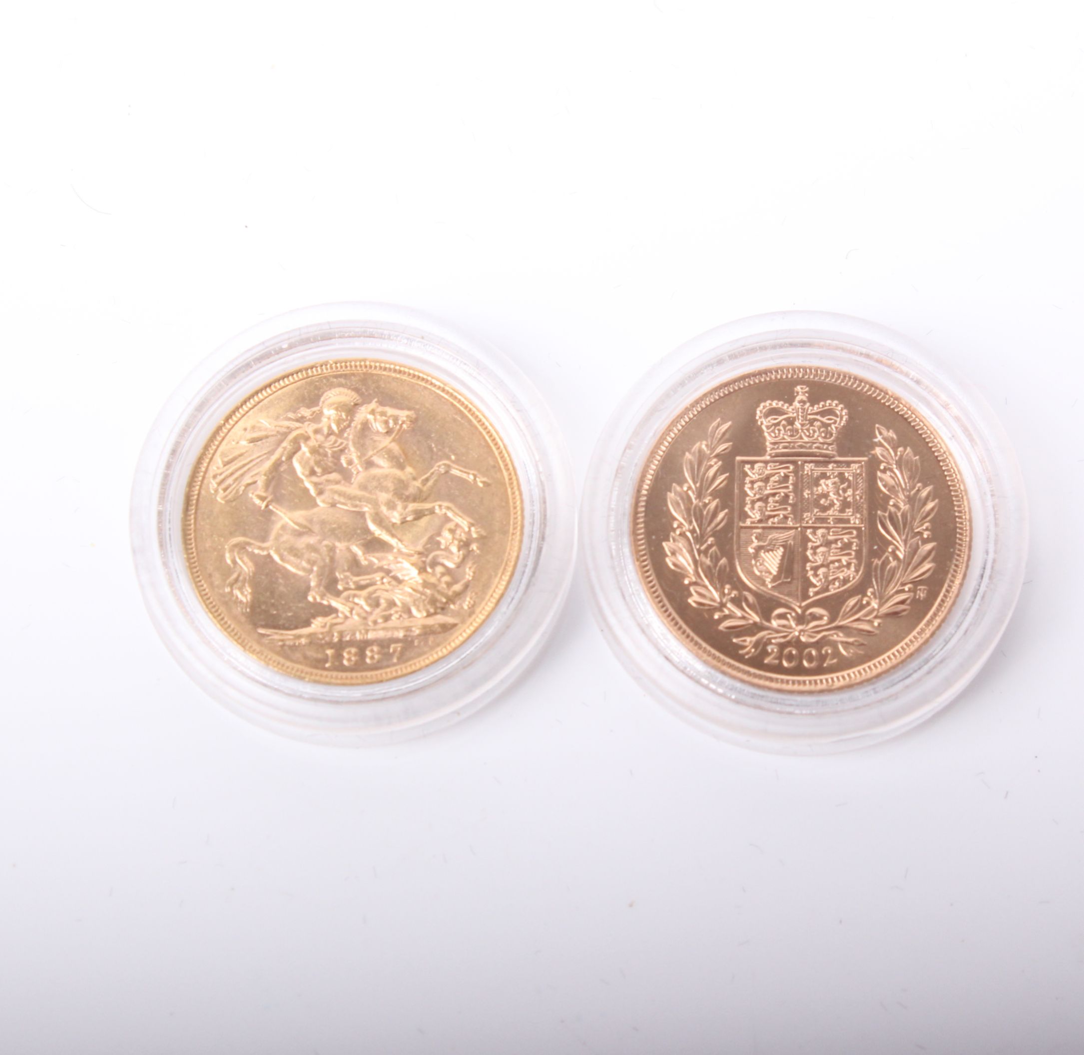 Westminster Golden Jubilee sovereign set; two gold sovereigns 1887 and 2002. Encapsulated and in one