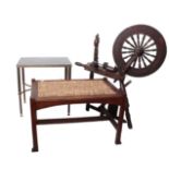 An Arts & Crafts style oak stool, spinning wheel and occasional table