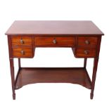 A Regency mahogany dressing table , circa 1815, the central frieze drawer flanked by double