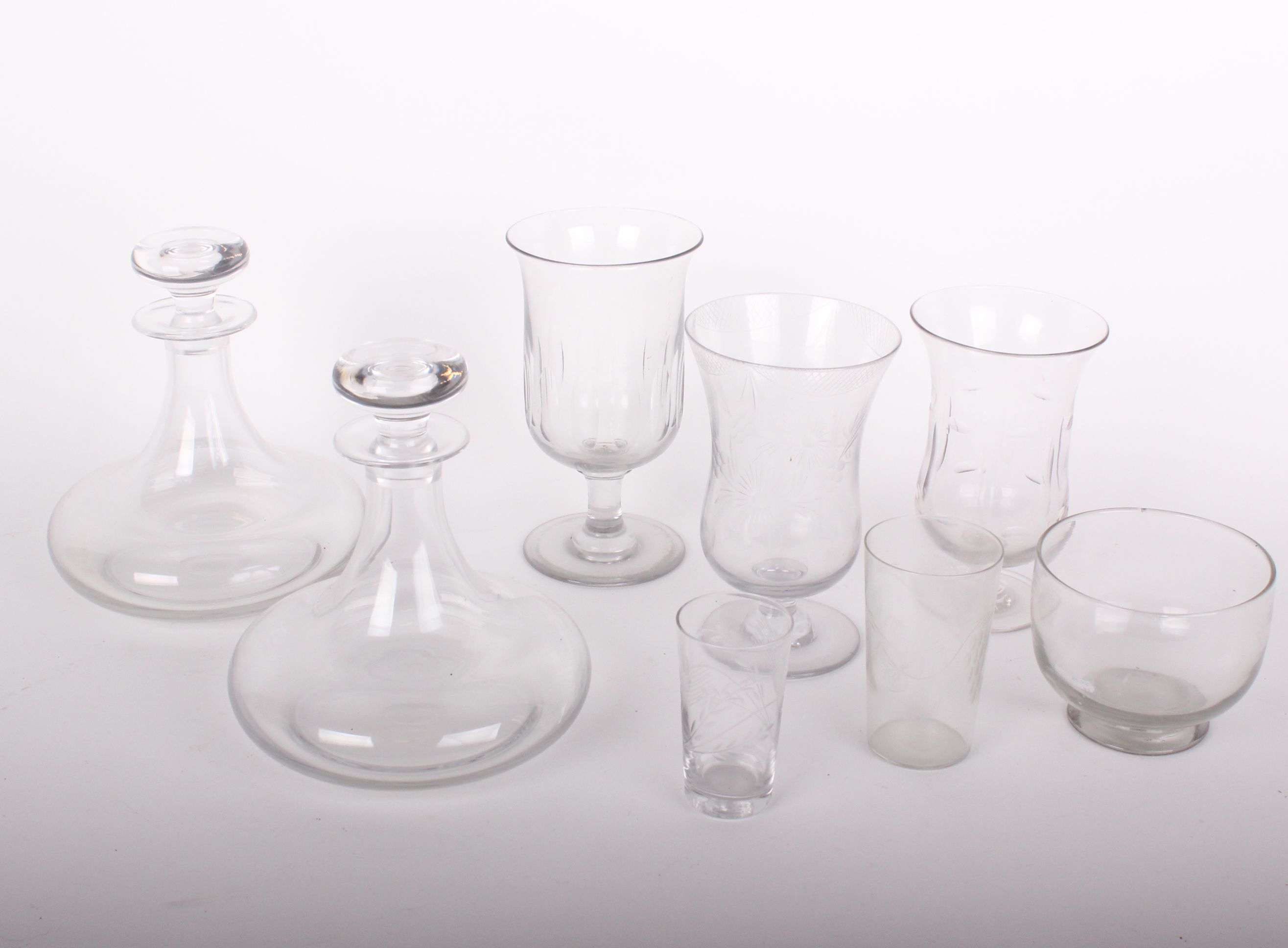 Glassware: part table set all engraved fruiting vine (twenty two pieces), three celery vases, a pair