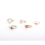 Five various 9ct gold rings, comprising: a white-opal oval-cabochon single stone ring, London