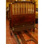 Two Heals mahogany single bed frames, with vertical splat ends, each bearing plaque