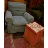 A club armchair with turquoise loose cover, a metal side table with cover and a pair of wing back