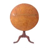 A George III oak tilt top tripod table on turned column and splayed legs with pad feet 71cm high,