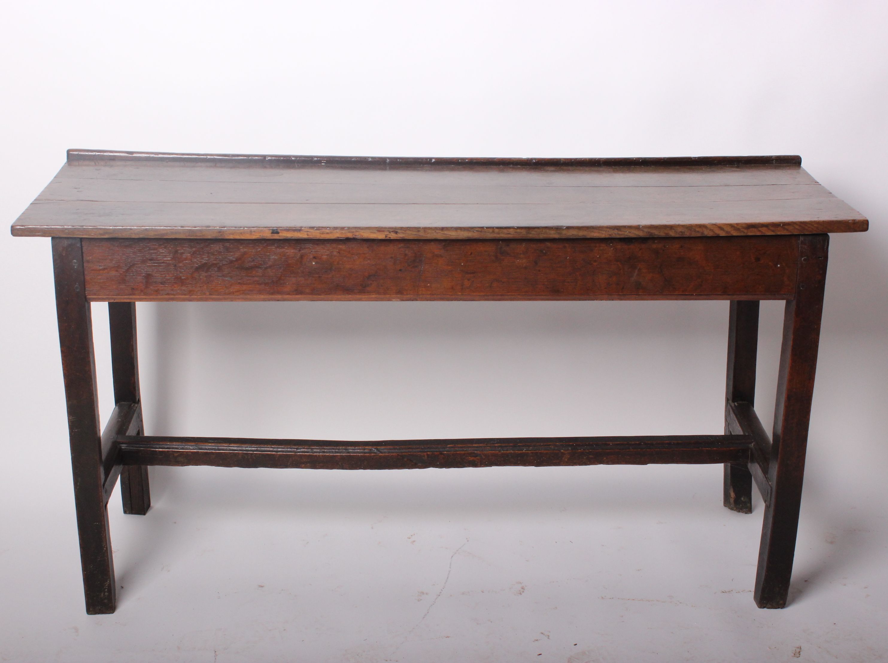 A narrow oak side table, 18th century and laterw.135cm d.43cm h.72cm