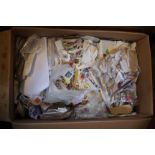 Two boxes of part-sorted used stamps. World wide stamps and some reference material