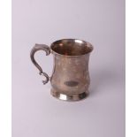 A silver baluster-shaped pint mug with leaf-capped double-scroll handle on a tapering foot,