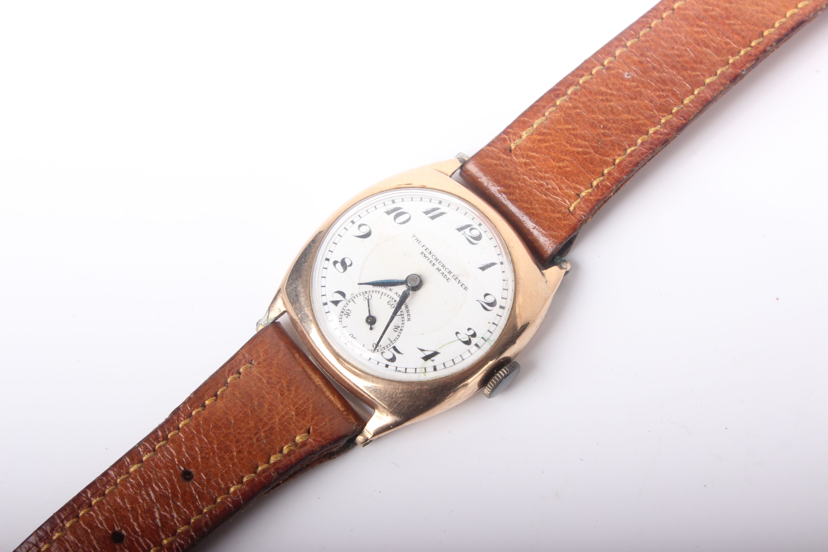 A lady's gold Tonneau shaped 'The Fenchurch Lever' wrist watch, stamped '9ct'
