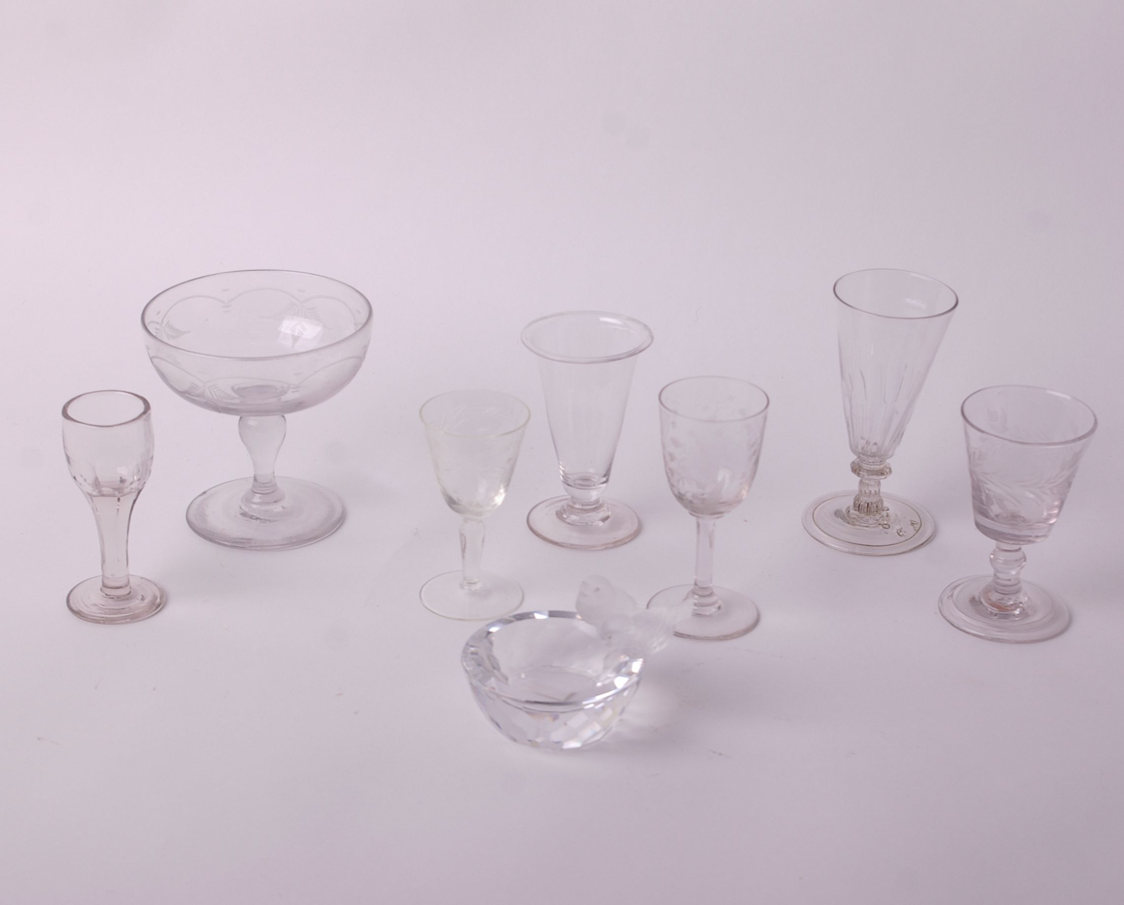 Glass: seven various stem glasses all hand blown and a crystal glass ashtray