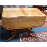 A Regency rosewood and satinwood banded pembroke table, with a frieze drawer and quadripartite