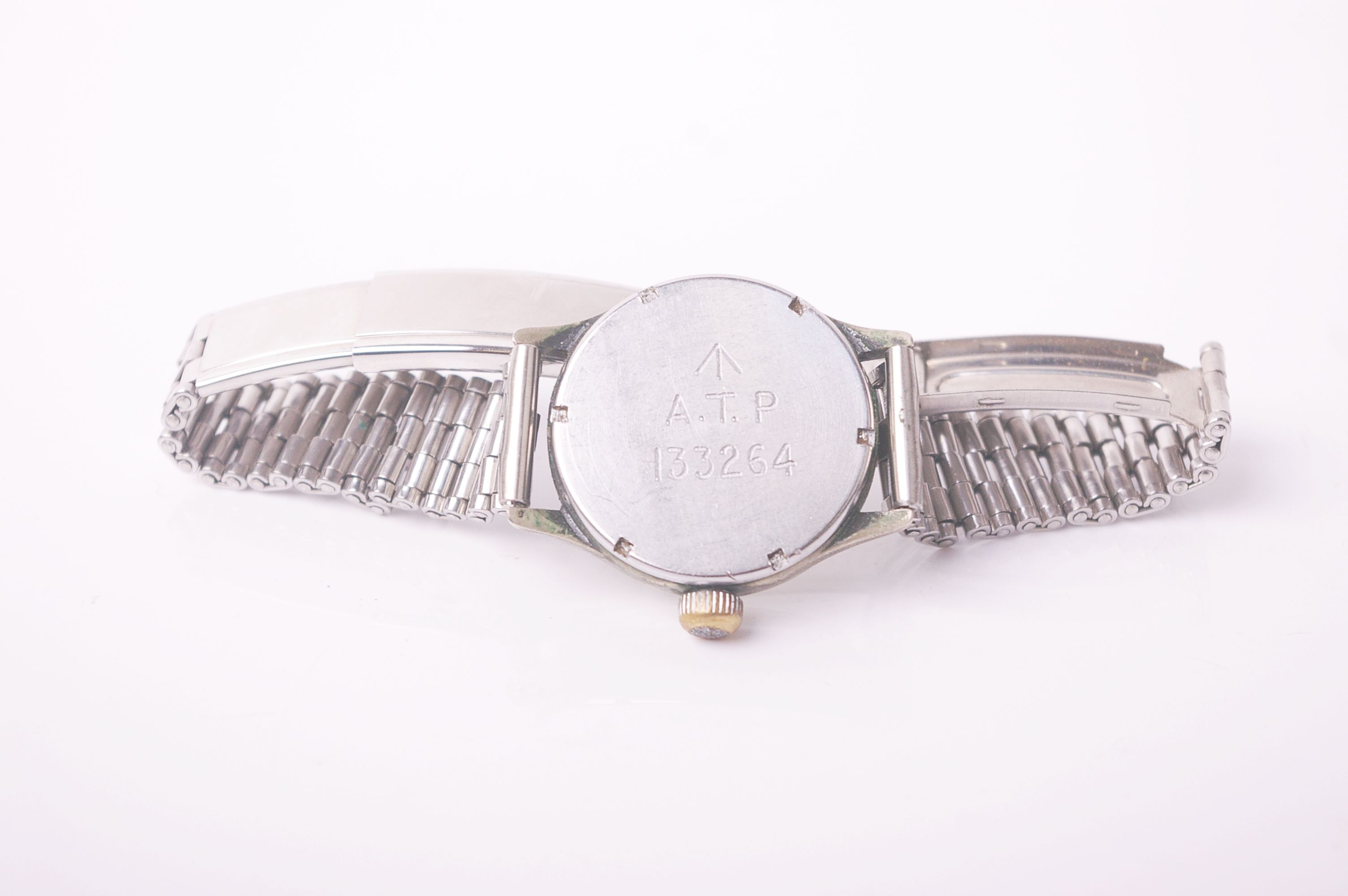 A military nickel-cased round wristwatch, the silvered dial with Arabic and dot indicators and - Image 2 of 3