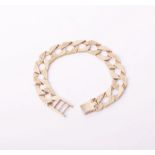 A 9ct gold part textured curb link bracelet, Sheffield Convention marks, 27.5g