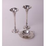 A pair of silver spill vases with shaped and beaded rims, Birmingham 1909 by H Mathews, 16.5cm high;
