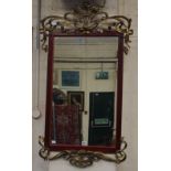 An Art Nouveau style wall mirror with floral gilt cresting 115 x 67cm