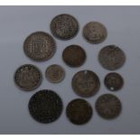 A collection of British pre-1920 silver coins from circulation and a few foreign ‘silver()’ coins in