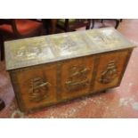 A 20th century coffer with pressed brass panel facings (width 107cm) with contents: a brass horn,