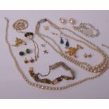 A collection of jewellery, including; an early 20th century rose gold and oval opal-doublet single