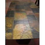 A slate tile top dining table with shaped stands, top 173cm x 101cm