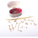 A collection of jewellery, including; a pair of 9ct gold hoop earrings; a pair of ‘dolphin’ hoop