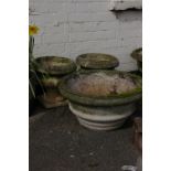 A pair of pedestal urns in Georgian style and one other larger planter, weathered concrete