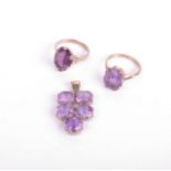 Three amethyst jewels, comprising; a 9ct gold and amethyst oval single stone ring, size O; a similar