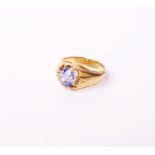An early 20th century gold and sapphire single stone gypsy ring, the oval native-cut sapphire