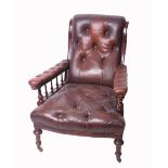 A leather upholstered armchair together with a French armchair