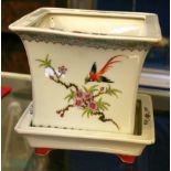 A Chinese porcelain jardinière, of square form, with two panels depicting birds amongst flowers, the