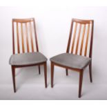 A pair of G-plan teak slat back dining chairs