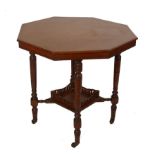 A late Victorian walnut octagonal table on turned tapering legs, 77cms diameter and a late Victorian