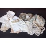 A quantity of late 19th and early 20th Century cotton and lace caps and bonnets and a collection