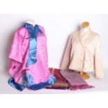 A pink and blue striped fringed paisley silk shawl; a 20th Century pink silk Oriental robe, a