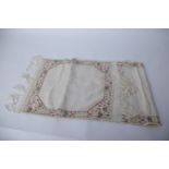 A 19th Century late Ottoman fine linen fringed towel, with a reversible embroidered floral design