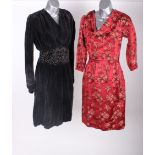 A late 1940s red floral brocade dress; a black velvet evening dress embellished with beads, an early