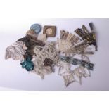 A quantity of trimmings; a pearl and beaded collar, a lamé evening bag, a French brocade