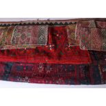 A quantity of textiles; comprising eight woven panels measuring approximately 29 x 19 cm, a red