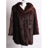 A 1950s musquash fur jacket, and a later dark brown coney fur jacket, both UK size 12/14 approx